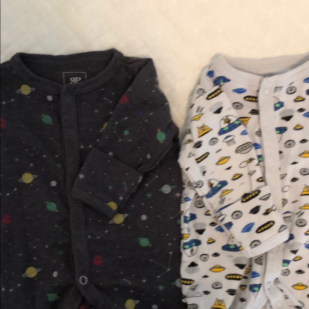 Two footie PJ’s 0-3 months